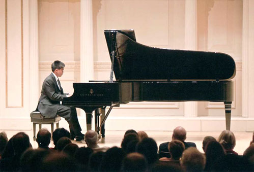 Picture of Student playing the piano at Carnegie Hall